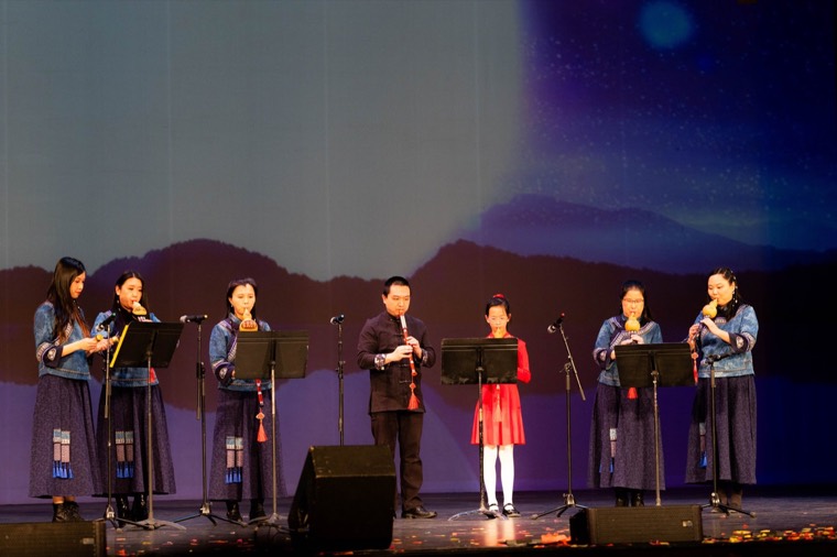 A Chinese music ensemble performs together