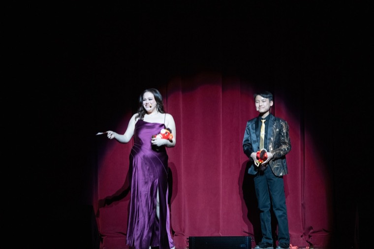 Two event hosts greet the New Year audience