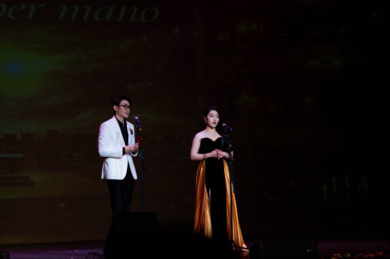 Two vocalists perform a duet on the New Year stage