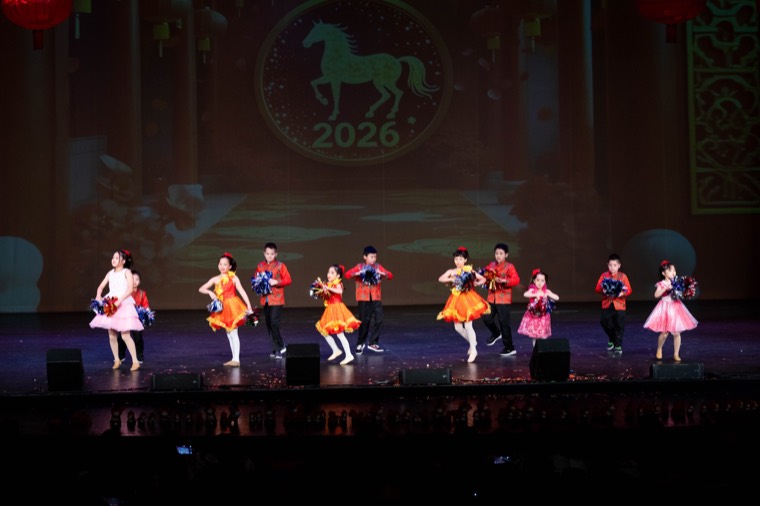 Young dancers perform in colorful costumes